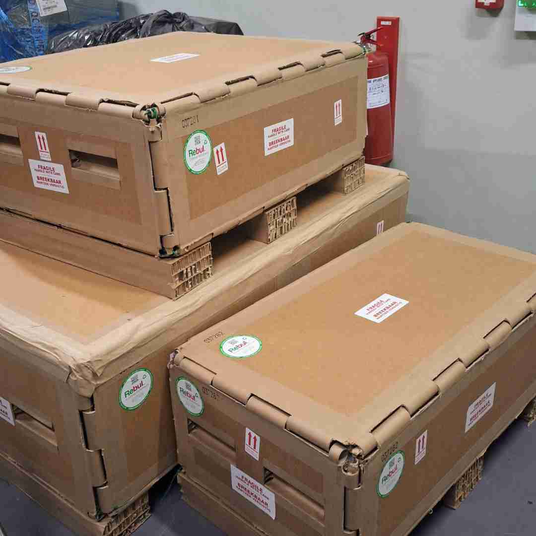 Stacked industrial packaging crates with pallets for secure and efficient shipping.